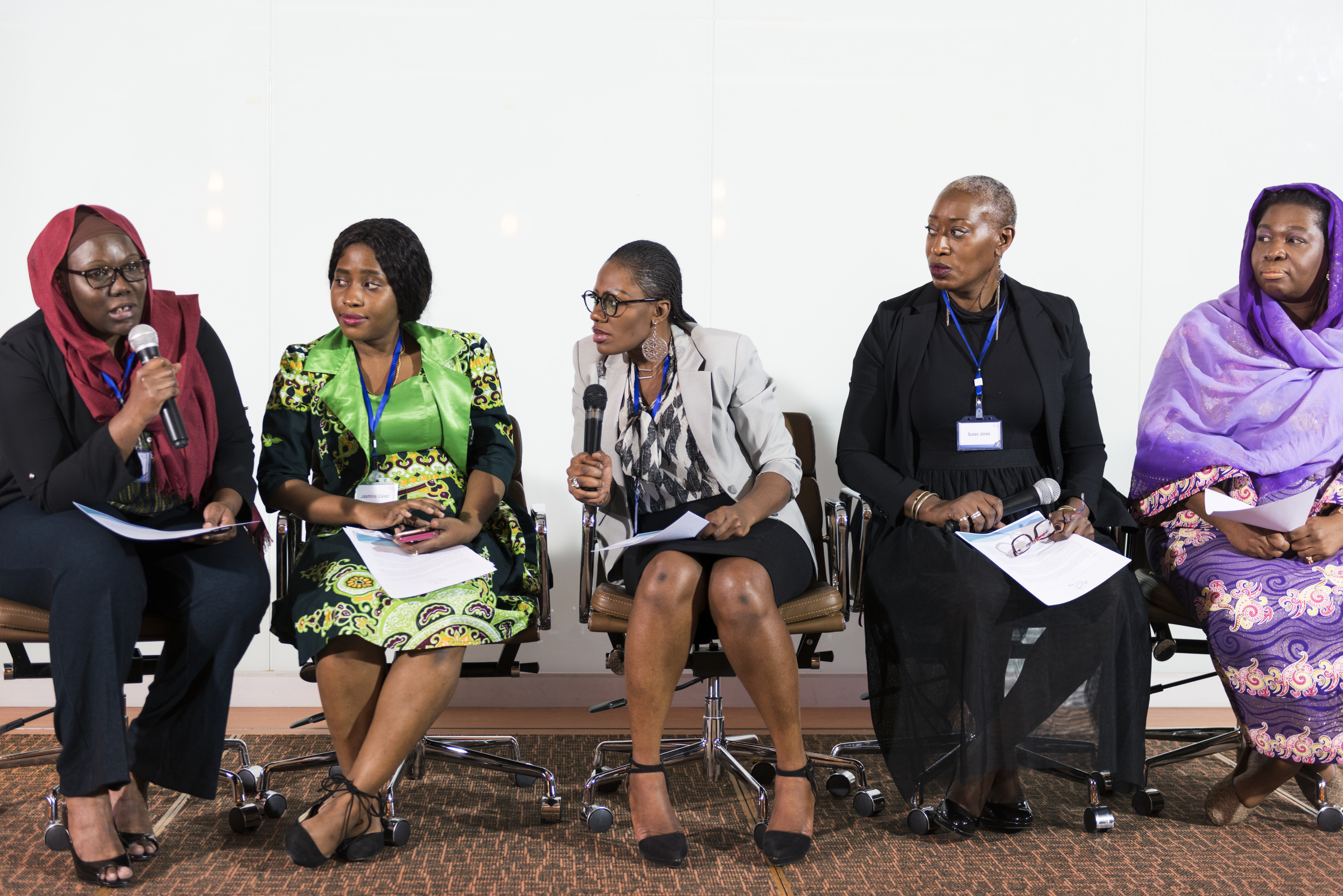 Professionals discussing ideas in a panel environment